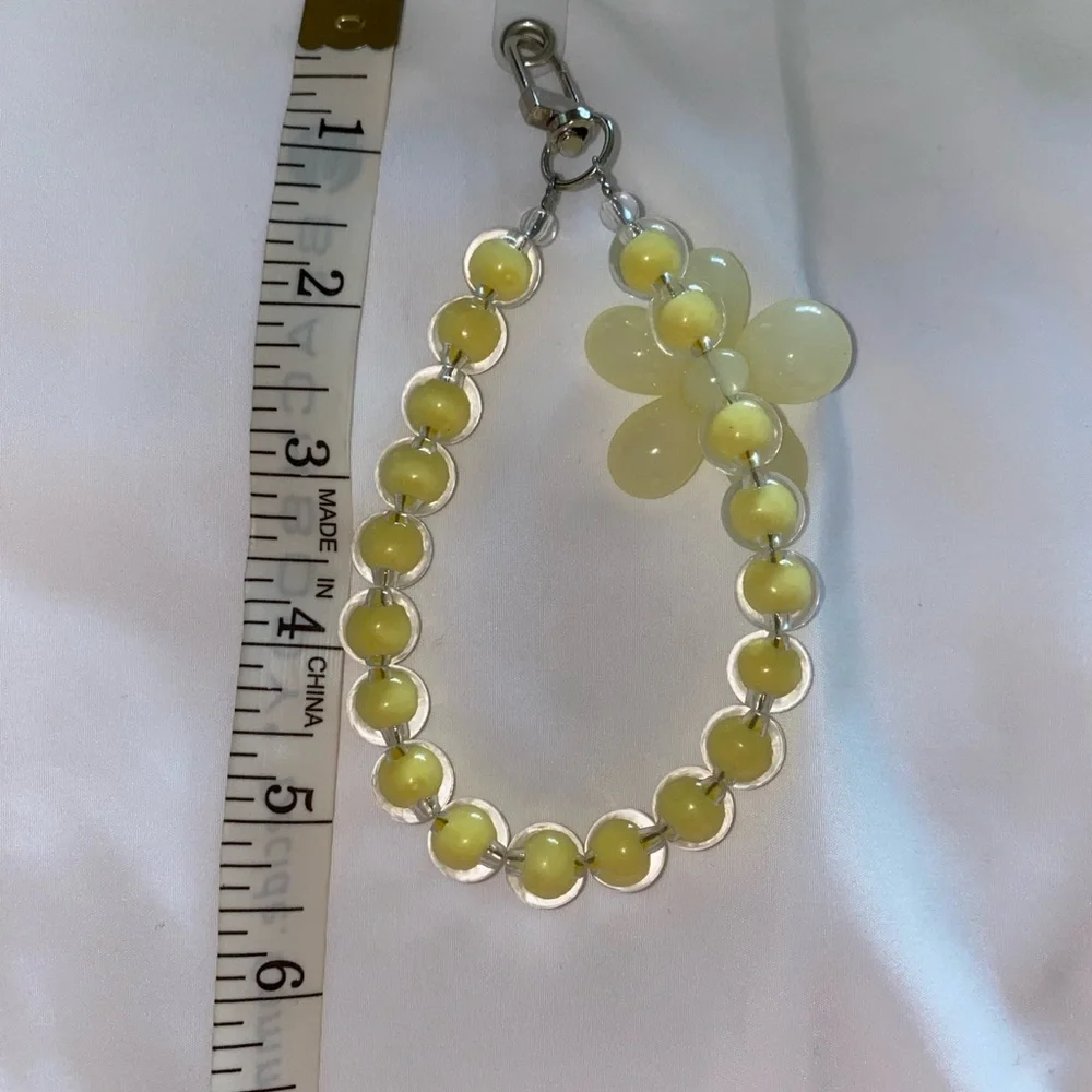 1-wrist lanyard for cells, keys and more Yellow Oversized Flower Charm